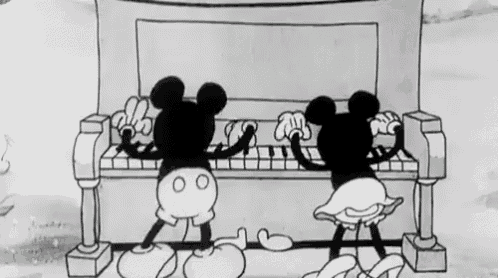 a black and white cartoon of mickey mouse and minnie mouse playing a piano .