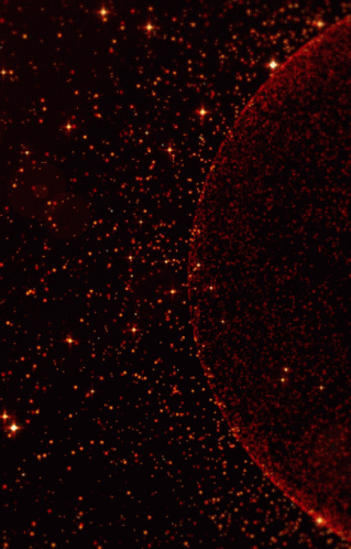 a red sphere in the middle of a black background with stars