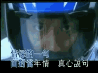 a close up of a person wearing a blue helmet with chinese writing