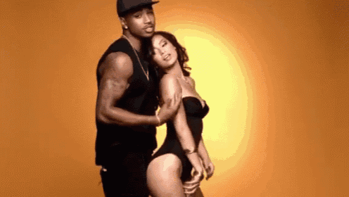 a man and a woman are posing for a picture together .