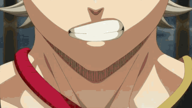 a close up of a person 's mouth with a red and yellow ribbon around it