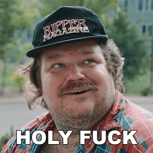 a man wearing a ripper magazine hat has the words holy fuck below him