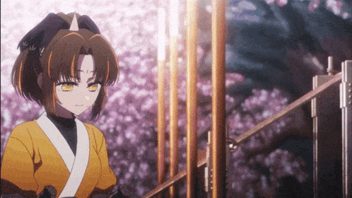 a girl with a horn on her head stands in front of a fence with flowers in the background