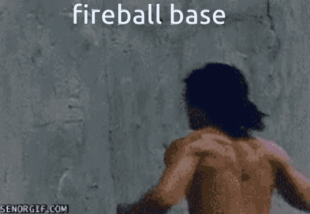 a man walking through a hole in a wall with the words fireball base above him