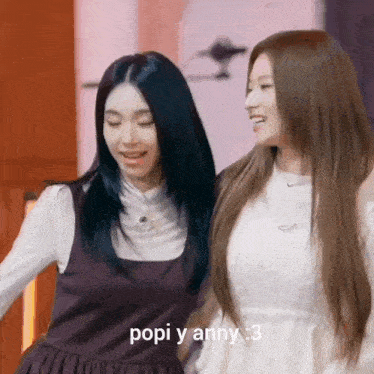 two girls are standing next to each other with the words popi y anny : 3 written on the bottom