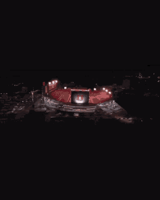 a stadium with a large u on the screen