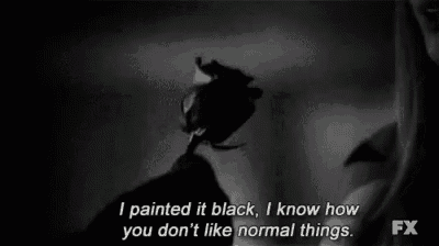 a black and white photo of a person holding a black rose with a quote from fx .
