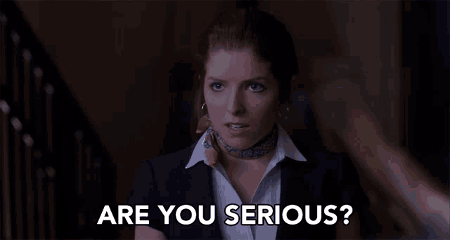 a woman with a scarf around her neck is asking if she is serious