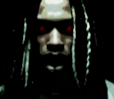a blurry picture of a person 's face with a hood on