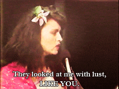 a woman talking into a microphone with the words they looked at me with lust like you