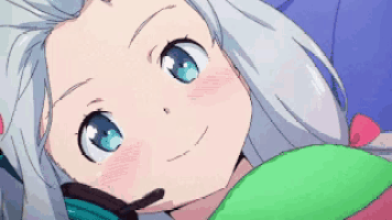 a girl with white hair and blue eyes is laying down