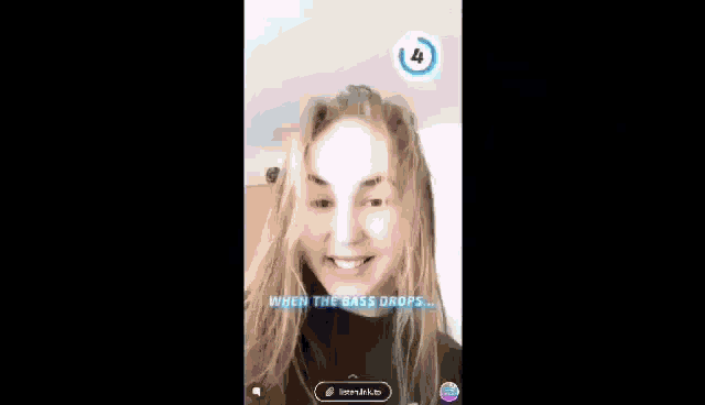 a woman with long blonde hair is smiling while using a snapchat filter .