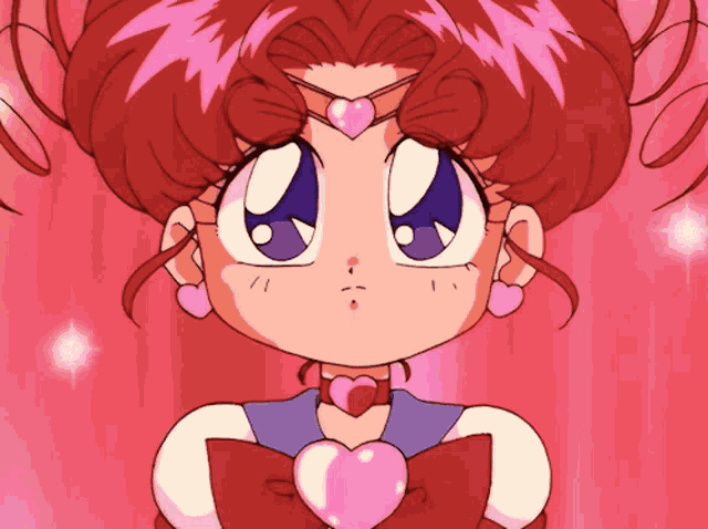 a little girl with red hair and a pink heart on her chest