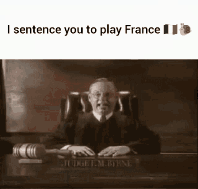 a judge sits at a desk with a gavel in front of him and the words i sentence you to play france