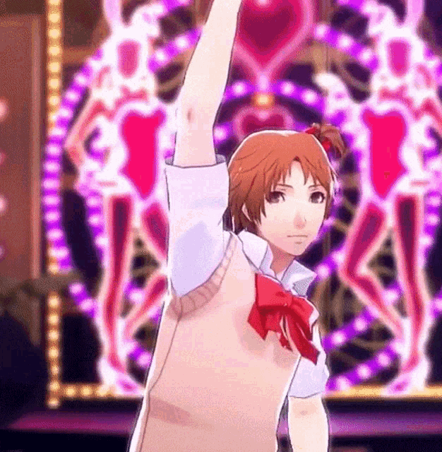 a girl with a red bow on her hair is raising her arm