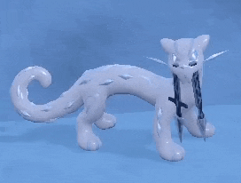 a white cat with a long tail is holding a sword .