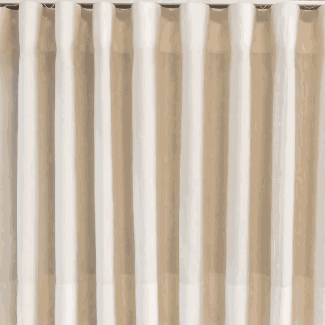 a white curtain is hanging on a window with the letters co and g visible