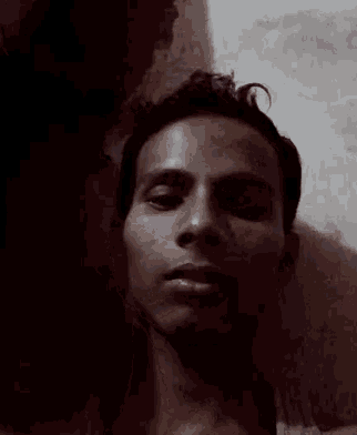 a close up of a man 's face with his mouth wide open