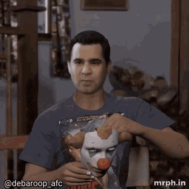 a man is wearing a clown mask on his face