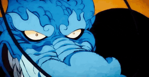 a close up of a cartoon character 's face with a sword .