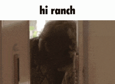 an older woman is standing in a doorway with the words hi ranch above her .