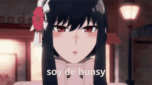 a girl with a flower in her hair has the words soy de bunsy on her face