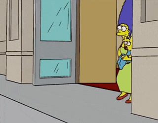 a group of simpsons characters are standing in front of a building