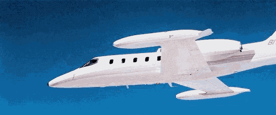 a white plane with the number 61 on the tail is flying in the sky
