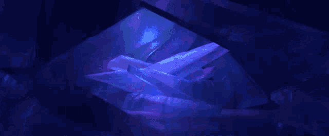 a blue background with a lot of light coming from the top