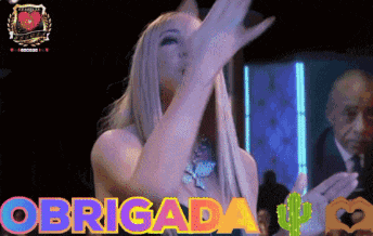 a woman blowing a kiss with the words obrigada in the background