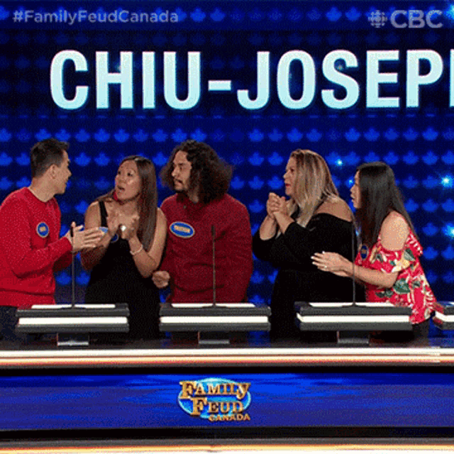 a group of people are sitting in front of a sign that says chiu-joser
