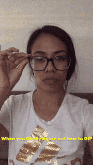 a woman wearing glasses is taking a selfie with the words when you finally figure out how to gif below her