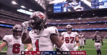 a football player with the number 1 on his jersey is celebrating