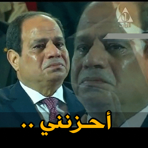 a man in a suit and tie is crying in front of a sign that says ' 1 '