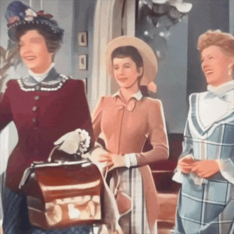 three women are standing next to each other and one is holding a purse