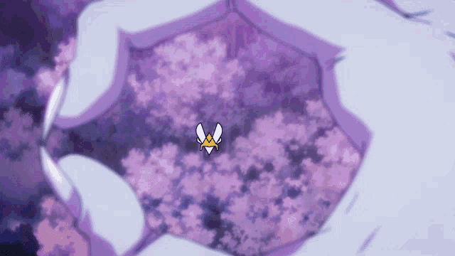 a purple umbrella with a yellow emblem on it