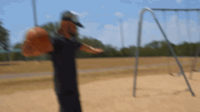 a blurry picture of a man holding a baseball bat
