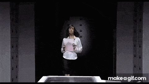a woman is holding a piece of paper in a dark room .