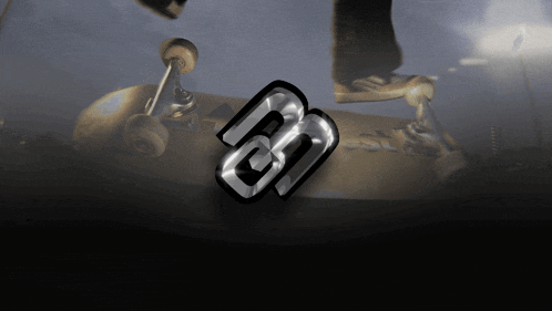 a skateboarder is doing a trick on a skateboard with the letter b on it