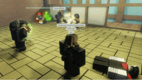 a group of people are playing a video game and one of them is laying on the floor talking to another person