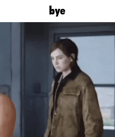a woman in a brown jacket is standing in front of a window and says bye