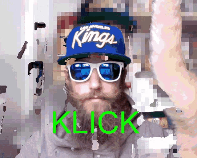 a pixelated image of a man wearing a los angeles kings hat and sunglasses