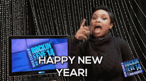 a woman says happy new year in front of a tv screen
