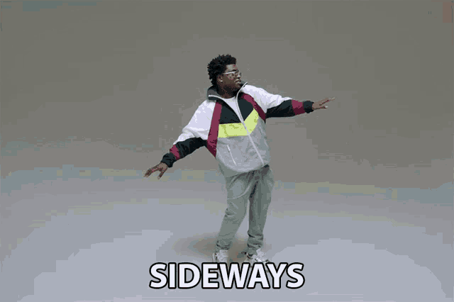 a man in a colorful jacket is dancing with the words sideways below him