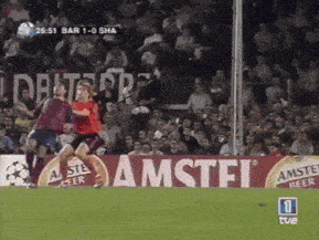 a soccer game is being played in front of an advertisement for amstel