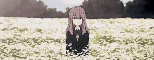 a girl in a suit is standing in a field of flowers .
