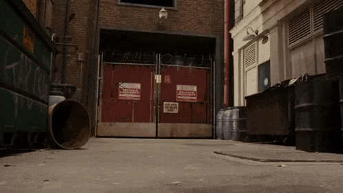 a red fence with a sign that says no parking on it
