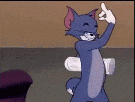 tom from the cartoon tom and jerry is giving the middle finger while holding a cup .