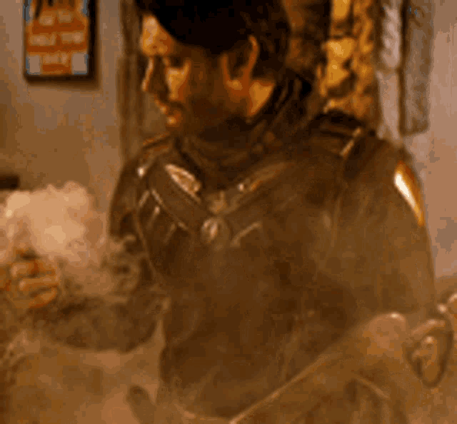 a man in armor is standing in front of a wall with a sign that says ' smoke '
