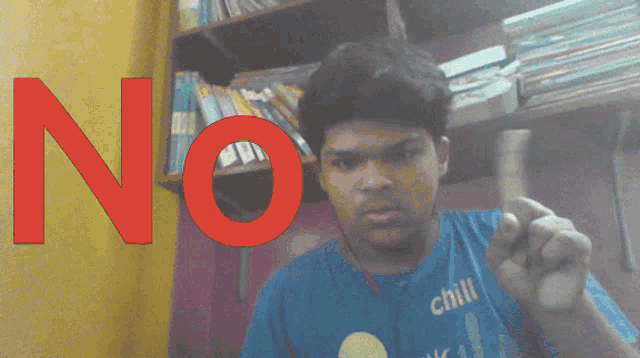 a man wearing a blue shirt that says chili is pointing at the camera